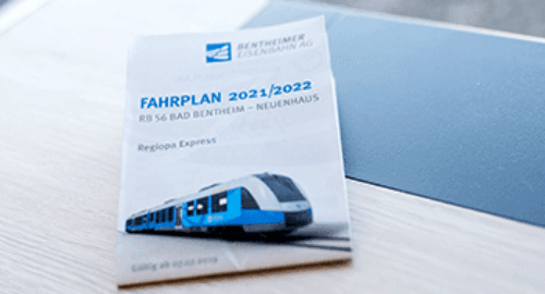 Printed special timetable and schedules of Bentheimer Eisenbahn AG on a table